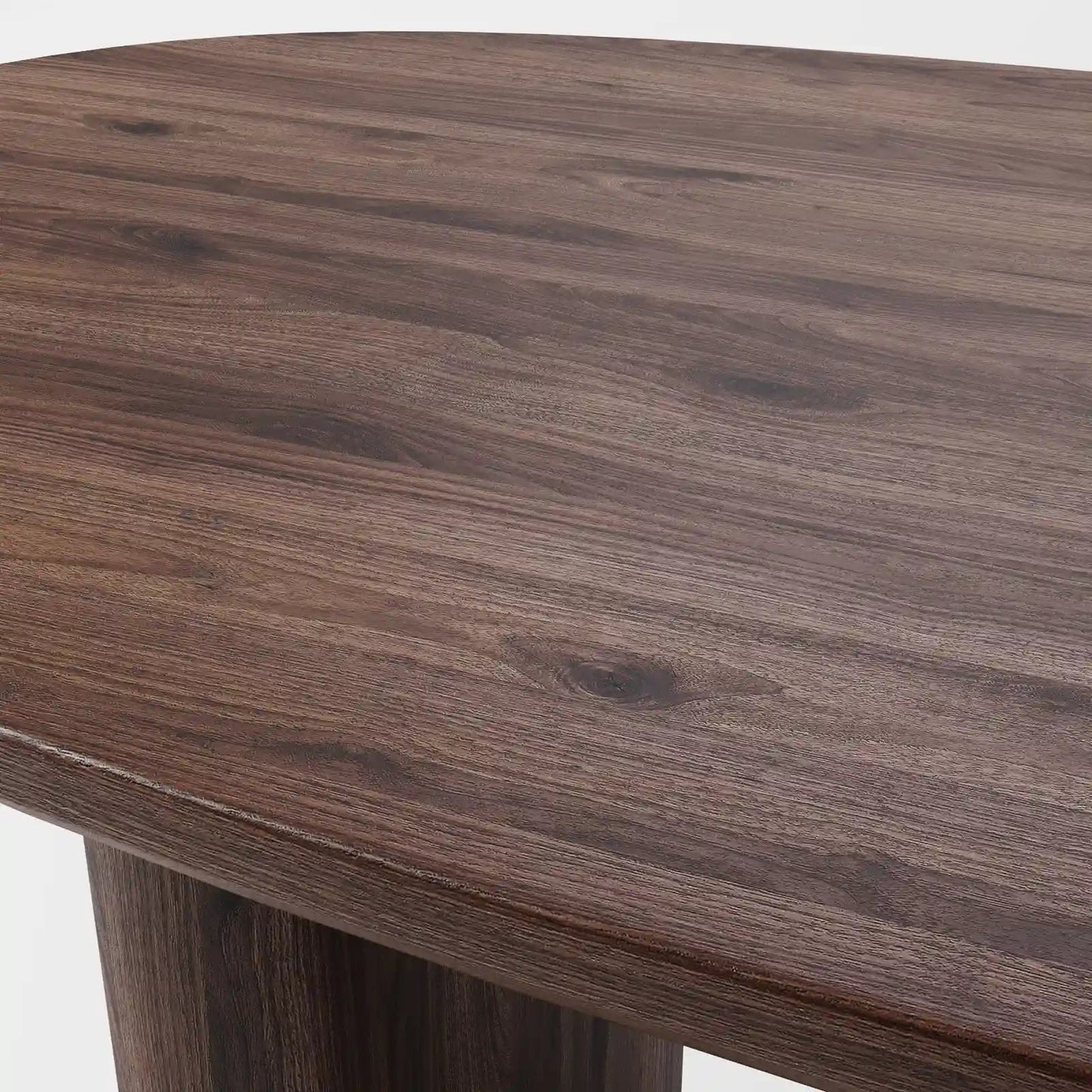 Architectural Elliptical Dining Table with Bold Monolithic Supports