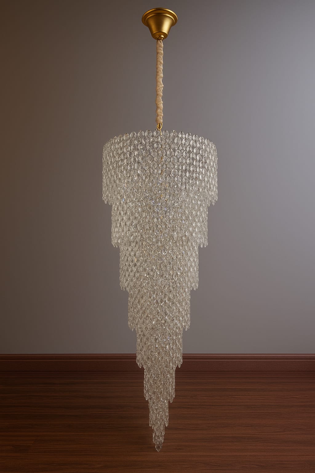 Chandelier hanging from the ceiling against a plain wall.