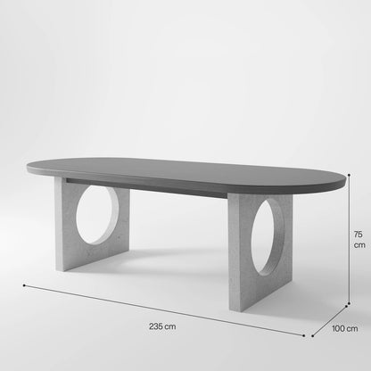 Architectural Oval Dining Table featuring Concrete Supports with Circular Voids