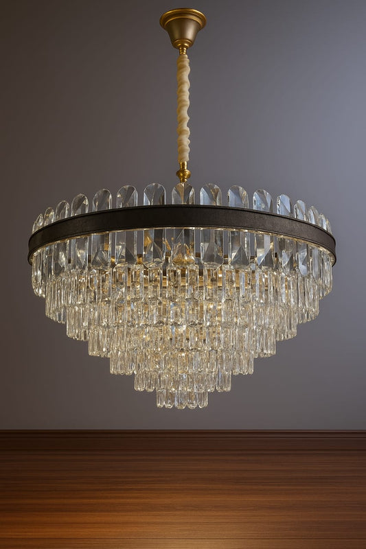 Chandelier hanging against a gray wall with wooden floor