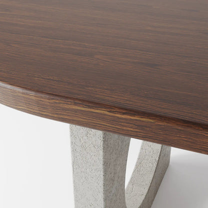 Architectural Oval Dining Table featuring Concrete Supports with Circular Voids