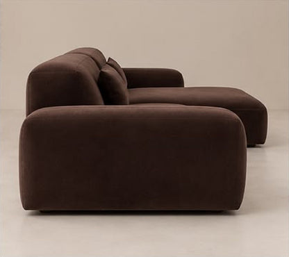 Brown modular sofa side view showing deep seat and chaise