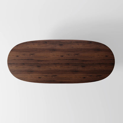 Architectural Elliptical Dining Table with Bold Monolithic Supports