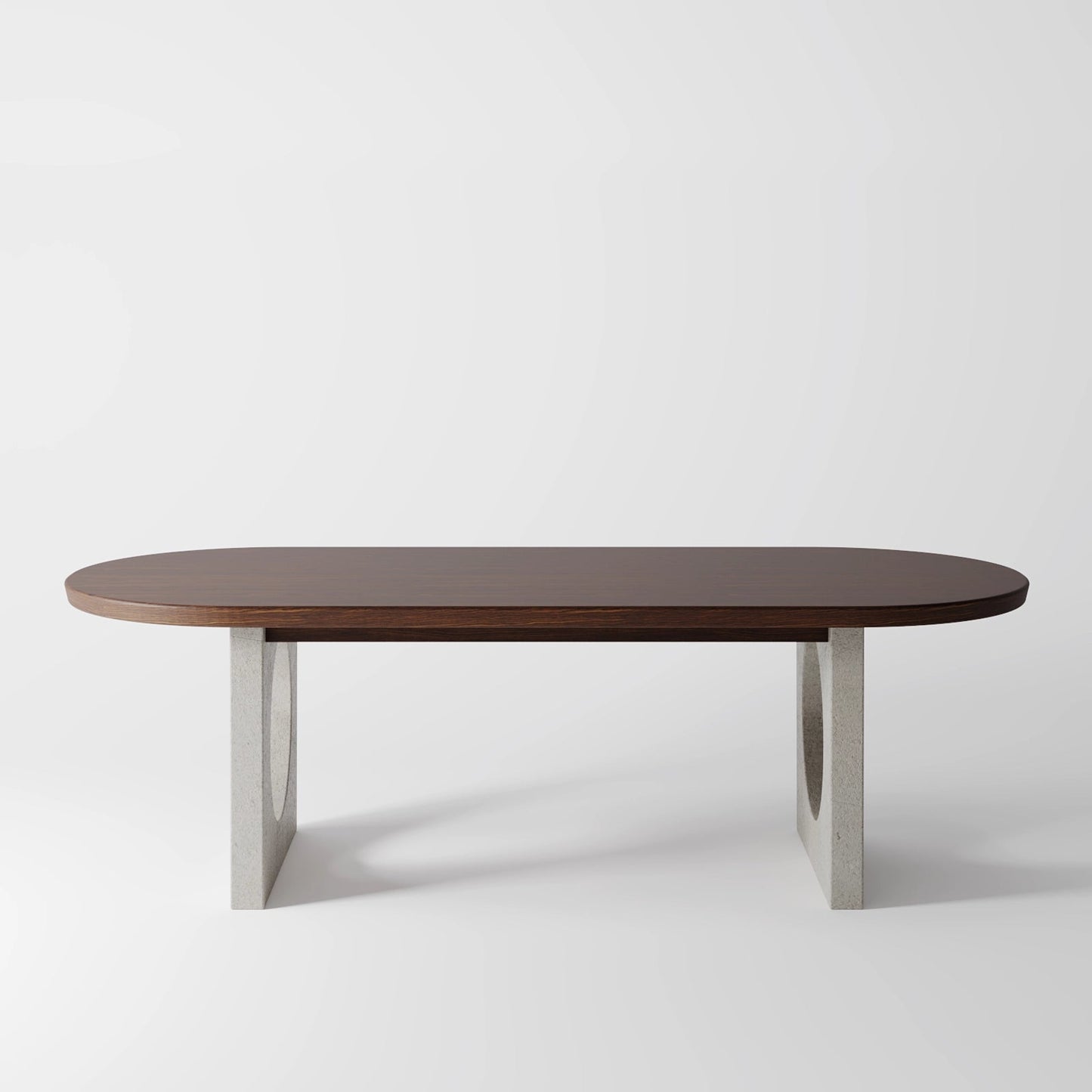 Architectural Oval Dining Table featuring Concrete Supports with Circular Voids