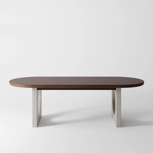 Architectural Oval Dining Table featuring Concrete Supports with Circular Voids