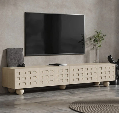 Miro TV unit side view showing carved door pattern and ball feet