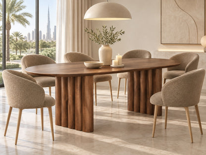 Ripple oval dining table in a Dubai villa dining room with taupe boucle chairs