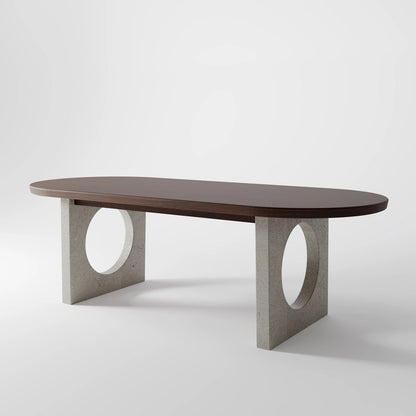 Architectural Oval Dining Table featuring Concrete Supports with Circular Voids