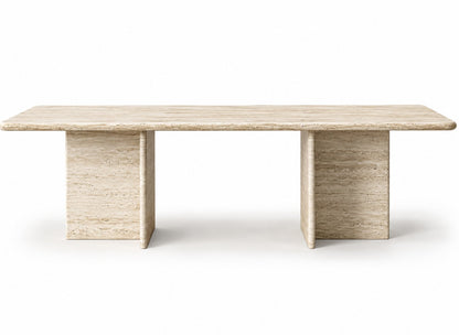 Front view of the Terra travertine dining table with T-shaped stone legs