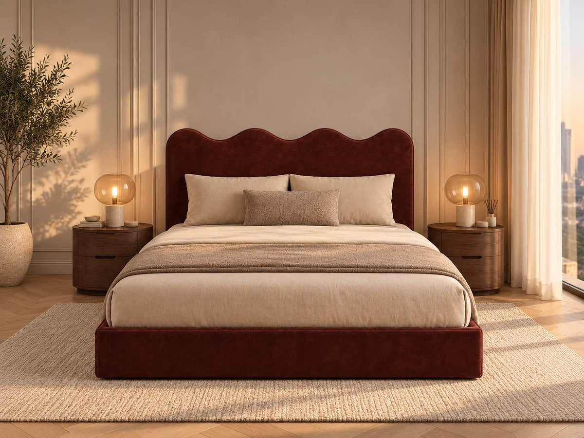 Sienna rust red velvet king bed with wavy headboard in a warm Dubai apartment bedroom — RoomVibe